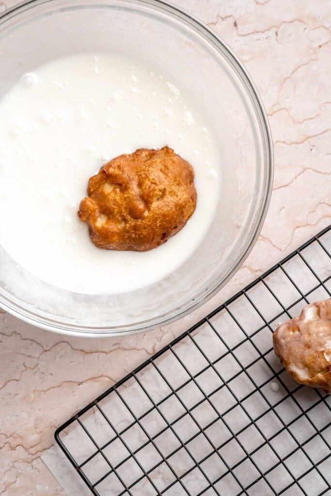 Old fashioned apple fritters are crispy, fluffy, and packed with juicy apples, warm spices, and a sweet glaze. A bakery-style treat at home! | aheadofthyme.com