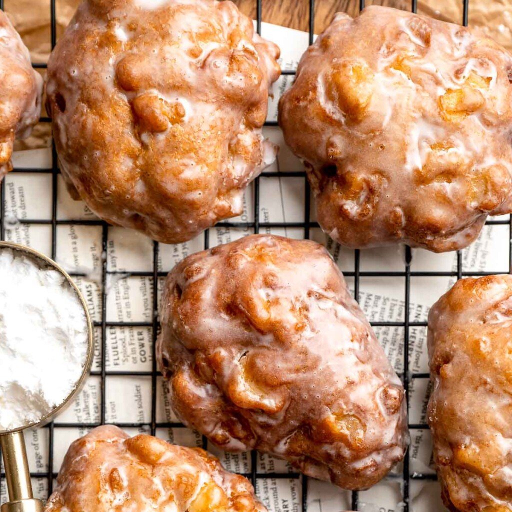Old fashioned apple fritters are crispy, fluffy, and packed with juicy apples, warm spices, and a sweet glaze. A bakery-style treat at home! | aheadofthyme.com