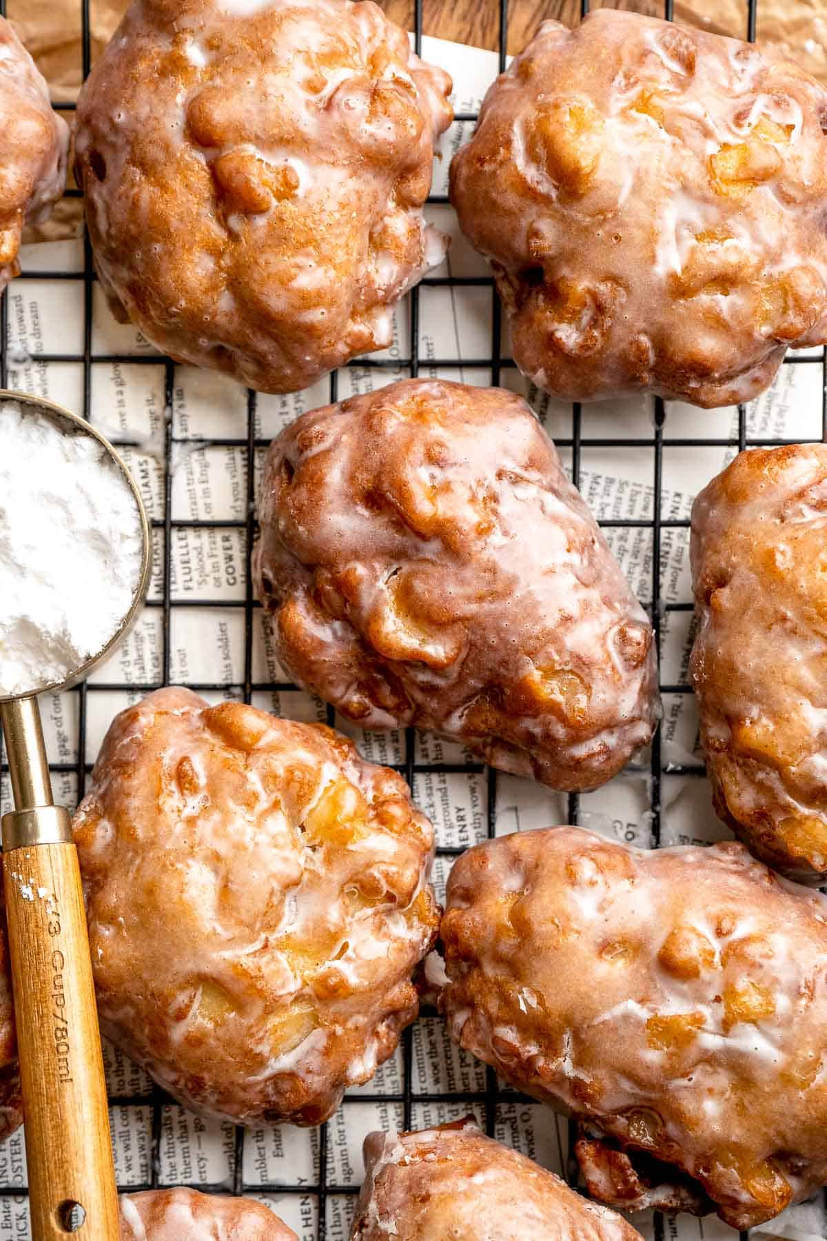 Old fashioned apple fritters are crispy, fluffy, and packed with juicy apples, warm spices, and a sweet glaze. A bakery-style treat at home! | aheadofthyme.com