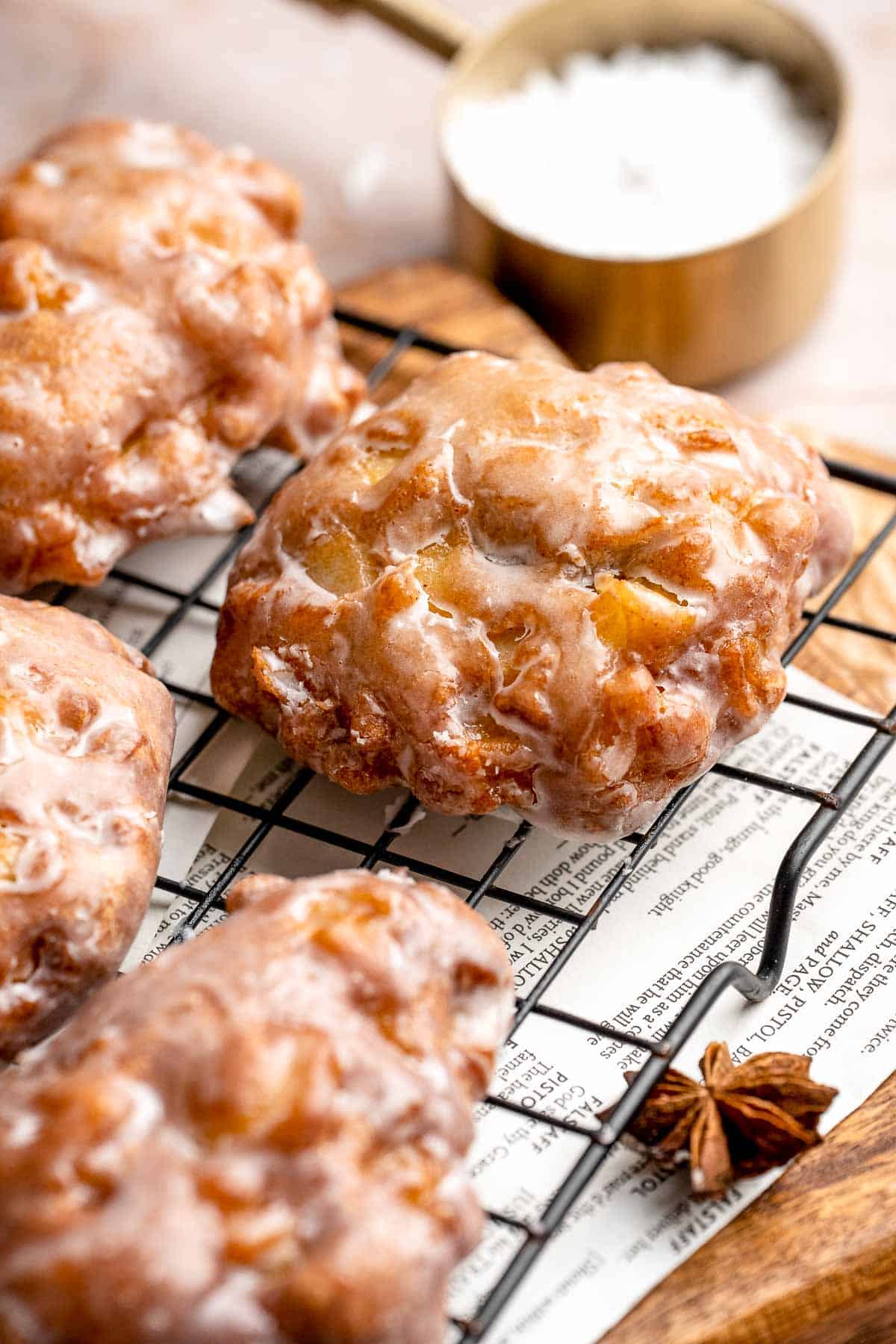 Old fashioned apple fritters are crispy, fluffy, and packed with juicy apples, warm spices, and a sweet glaze. A bakery-style treat at home! | aheadofthyme.com