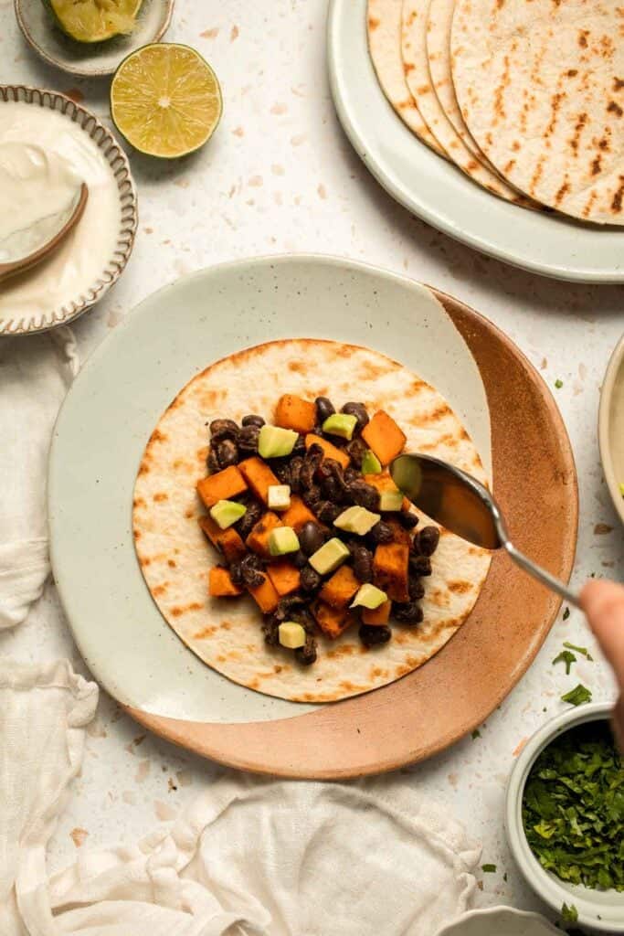 Spice up taco night with these delicious Sweet Potato and Black Bean Tacos. A quick and healthy vegetarian dinner ready in under 30 minutes. | aheadofthyme.com