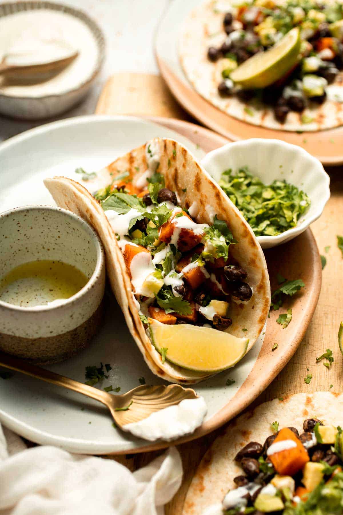 Spice up taco night with these delicious Sweet Potato and Black Bean Tacos. A quick and healthy vegetarian dinner ready in under 30 minutes. | aheadofthyme.com
