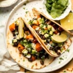 Spice up taco night with these delicious Sweet Potato and Black Bean Tacos. A quick and healthy vegetarian dinner ready in under 30 minutes. | aheadofthyme.com