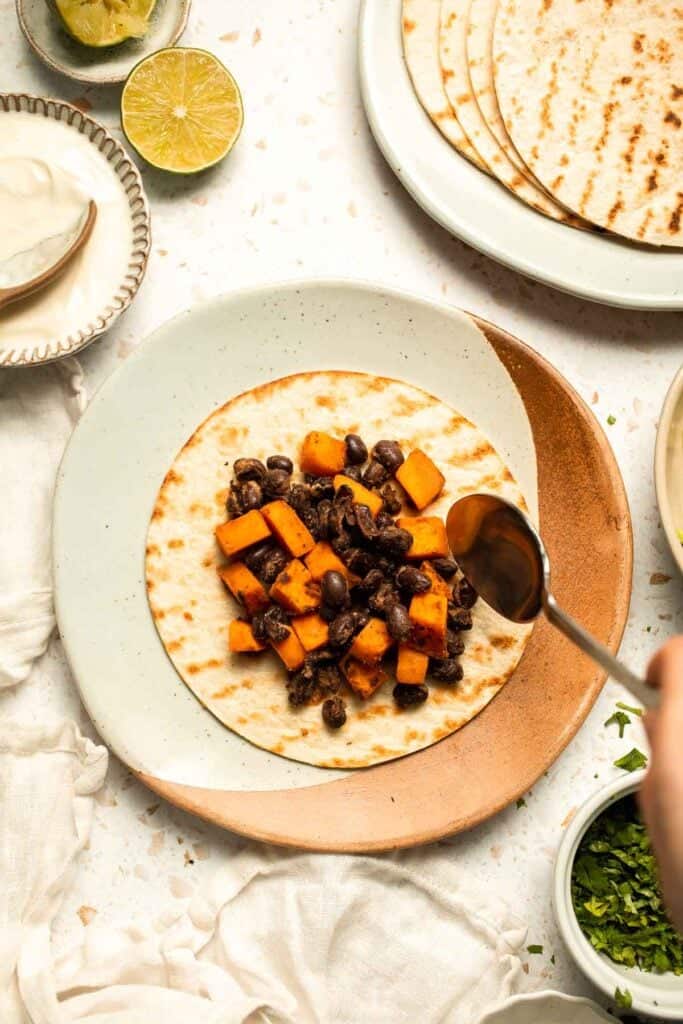 Spice up taco night with these delicious Sweet Potato and Black Bean Tacos. A quick and healthy vegetarian dinner ready in under 30 minutes. | aheadofthyme.com