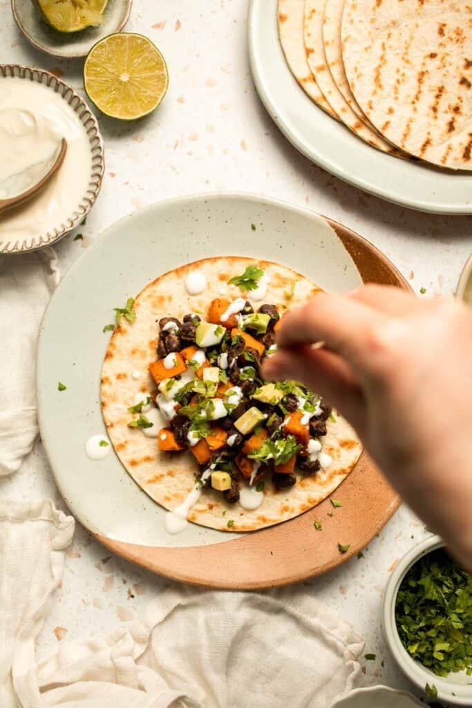 Spice up taco night with these delicious Sweet Potato and Black Bean Tacos. A quick and healthy vegetarian dinner ready in under 30 minutes. | aheadofthyme.com