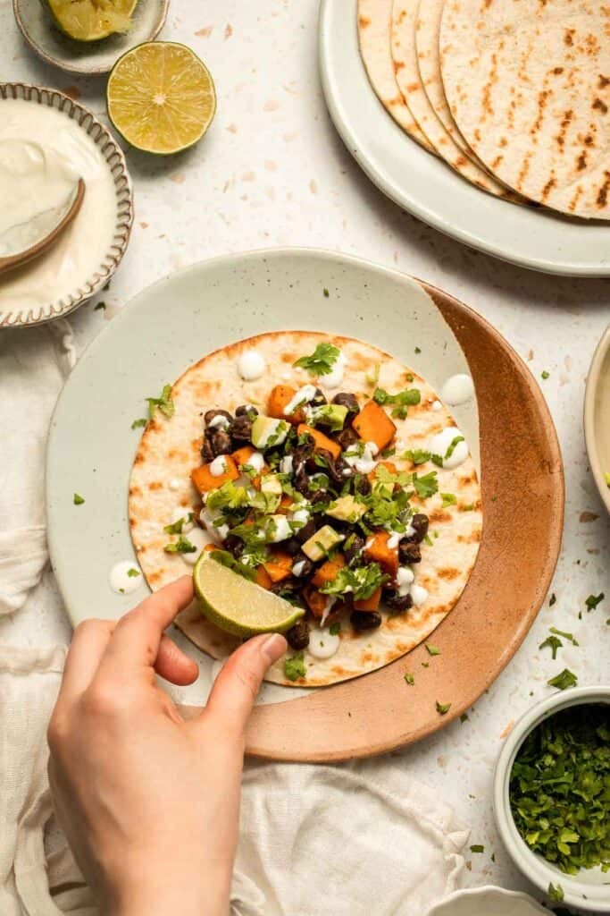 Spice up taco night with these delicious Sweet Potato and Black Bean Tacos. A quick and healthy vegetarian dinner ready in under 30 minutes. | aheadofthyme.com