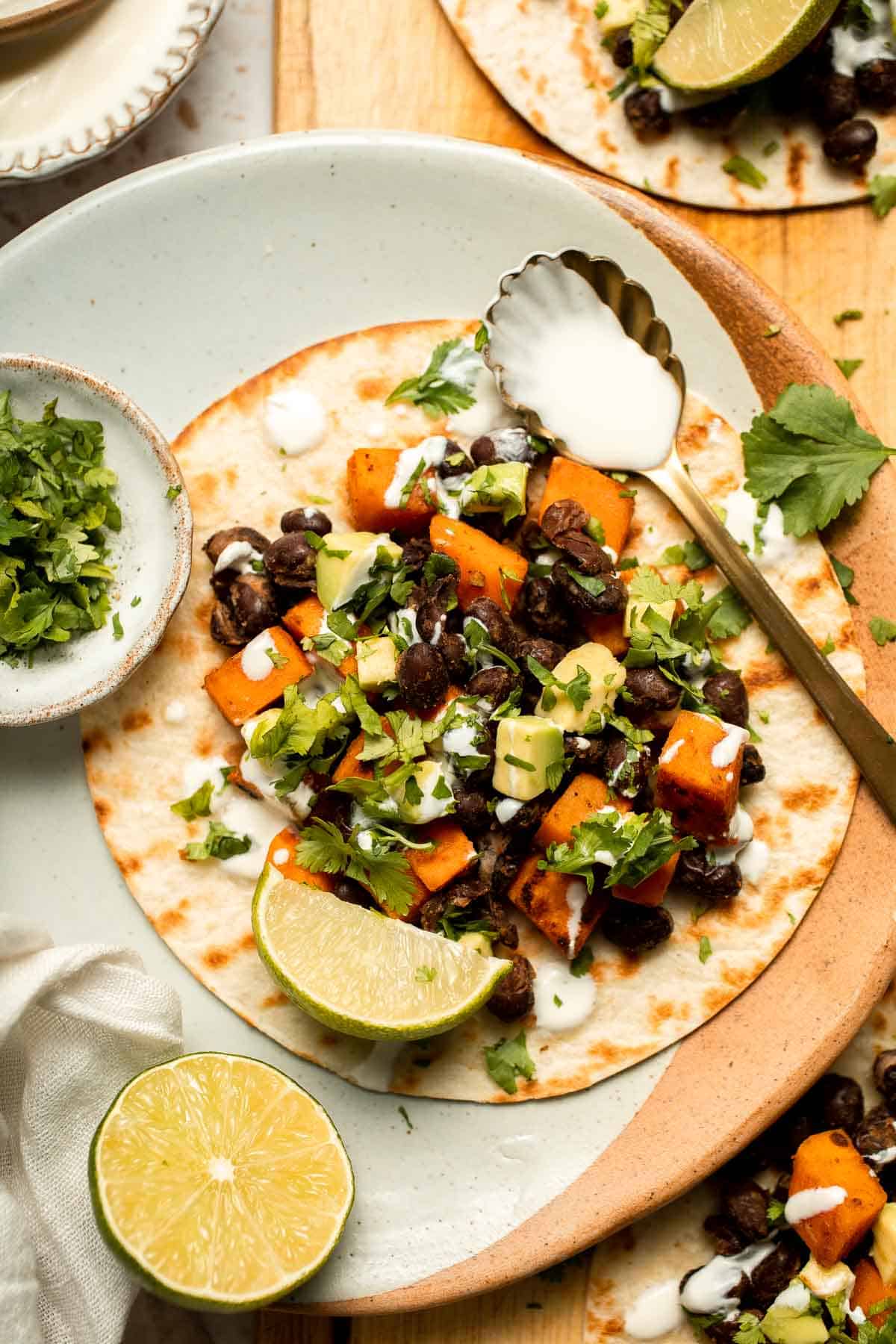 Spice up taco night with these delicious Sweet Potato and Black Bean Tacos. A quick and healthy vegetarian dinner ready in under 30 minutes. | aheadofthyme.com