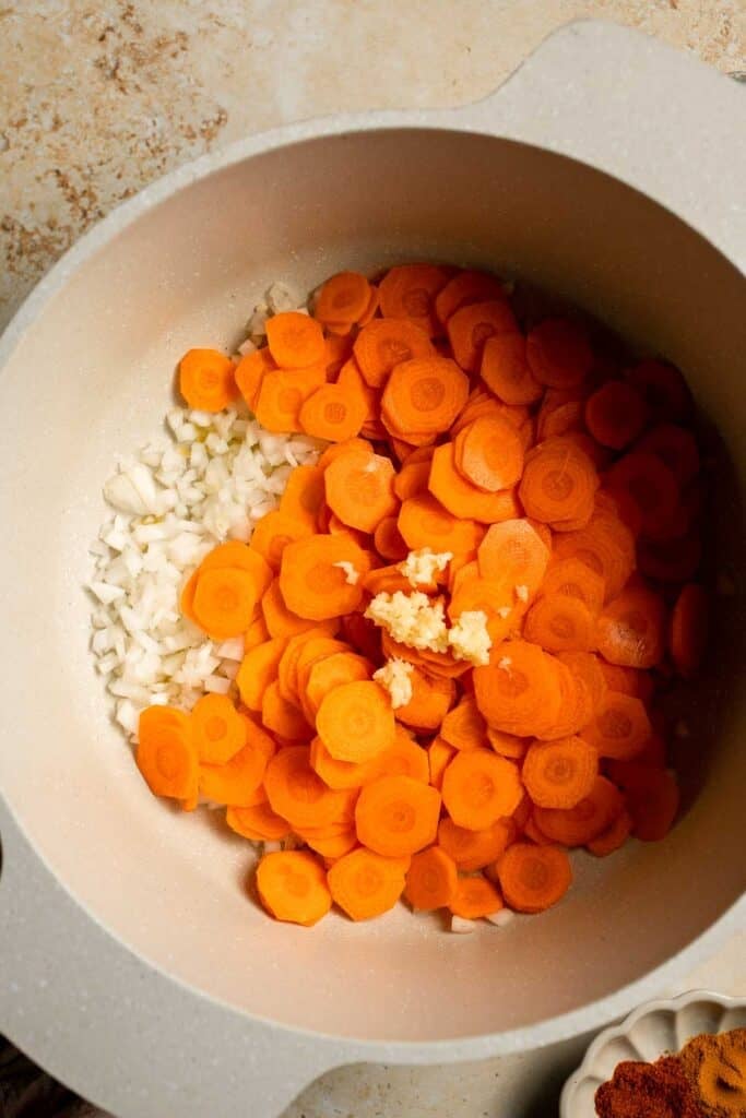 Looking for a hearty and healthy meal? This vegan red lentil soup with carrots is an easy one pot lunch or dinner packed with protein and flavor. | aheadofthyme.com