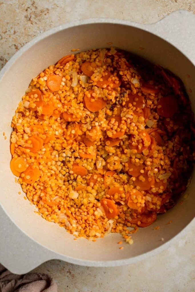 Looking for a hearty and healthy meal? This vegan red lentil soup with carrots is an easy one pot lunch or dinner packed with protein and flavor. | aheadofthyme.com