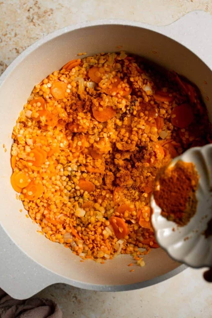 Looking for a hearty and healthy meal? This vegan red lentil soup with carrots is an easy one pot lunch or dinner packed with protein and flavor. | aheadofthyme.com