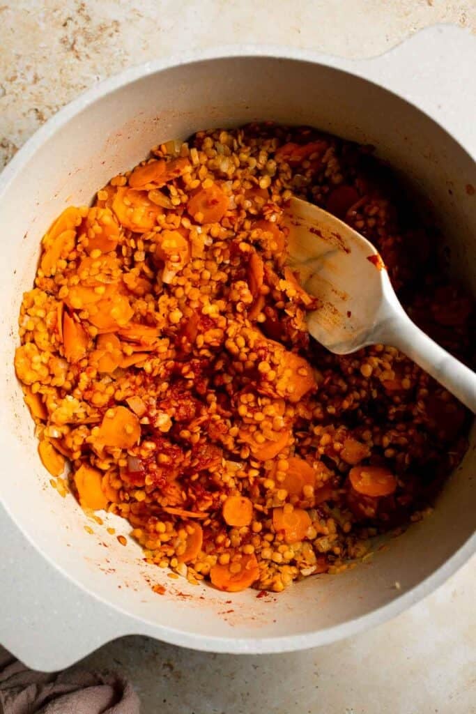 Looking for a hearty and healthy meal? This vegan red lentil soup with carrots is an easy one pot lunch or dinner packed with protein and flavor. | aheadofthyme.com