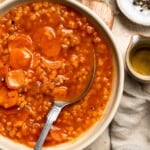 Looking for a hearty and healthy meal? This vegan red lentil soup with carrots is an easy one pot lunch or dinner packed with protein and flavor. | aheadofthyme.com