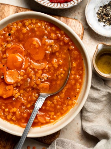 Looking for a hearty and healthy meal? This vegan red lentil soup with carrots is an easy one pot lunch or dinner packed with protein and flavor. | aheadofthyme.com