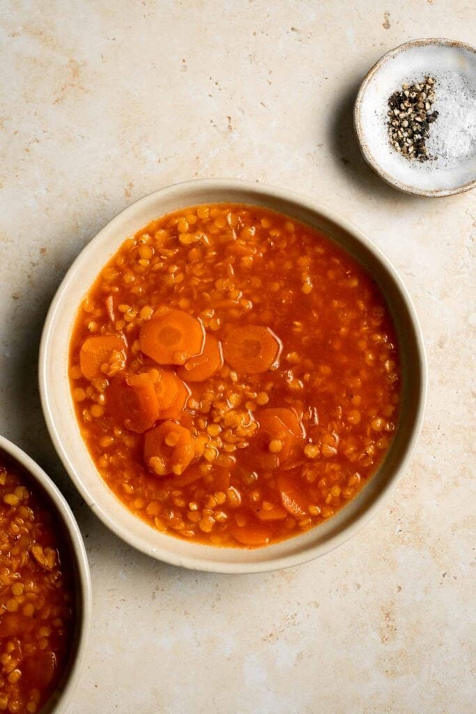 Looking for a hearty and healthy meal? This vegan red lentil soup with carrots is an easy one pot lunch or dinner packed with protein and flavor. | aheadofthyme.com