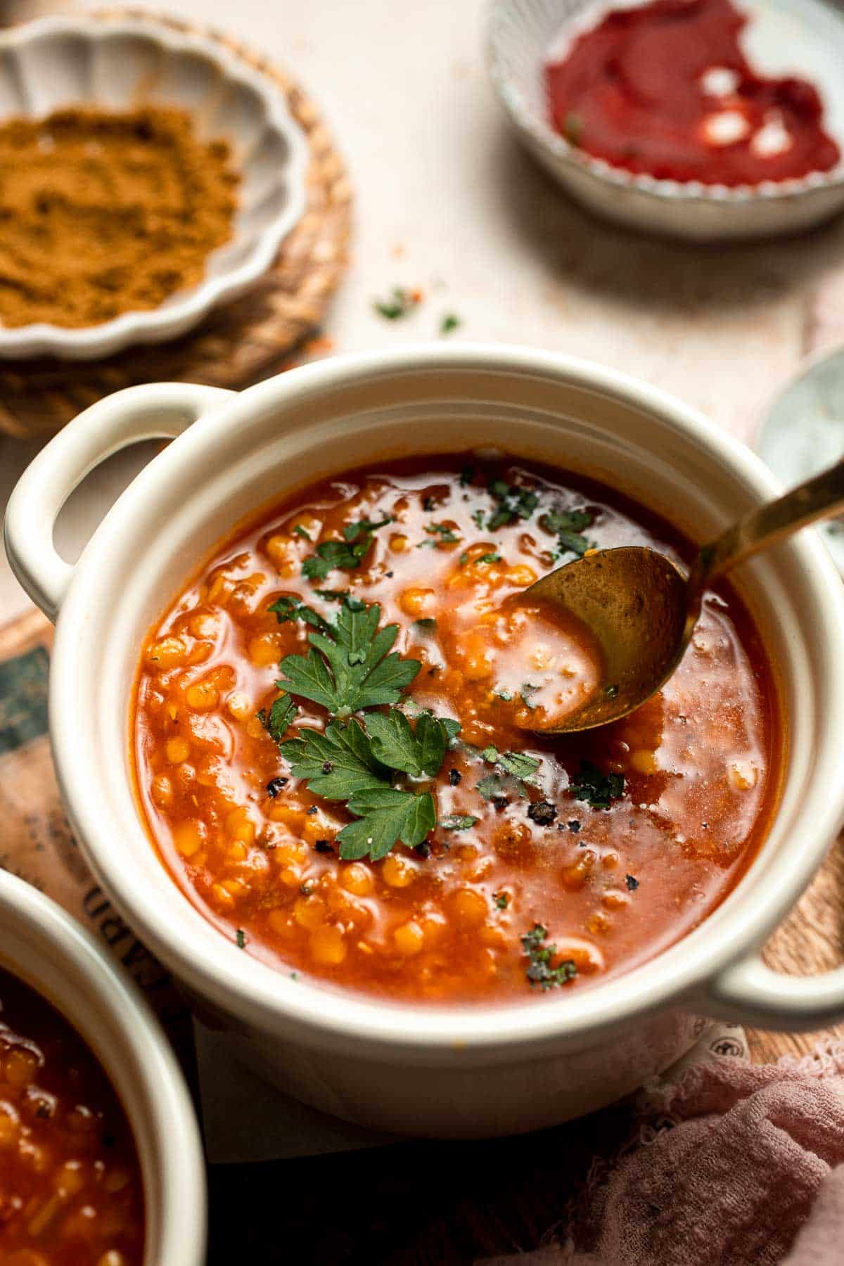 Looking for a hearty and healthy meal? This vegan red lentil soup with carrots is an easy one pot lunch or dinner packed with protein and flavor. | aheadofthyme.com