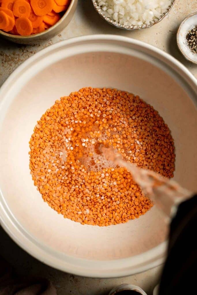 Looking for a hearty and healthy meal? This vegan red lentil soup with carrots is an easy one pot lunch or dinner packed with protein and flavor. | aheadofthyme.com