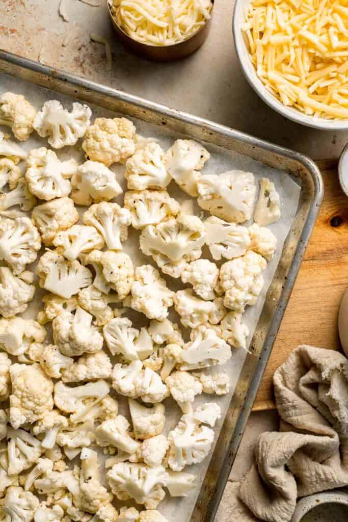 Easy Baked Cauliflower Cheese is the ultimate creamy, cheesy, golden comfort food side dish made with roasted cauliflower and rich homemade cheese sauce. | aheadofthyme.com