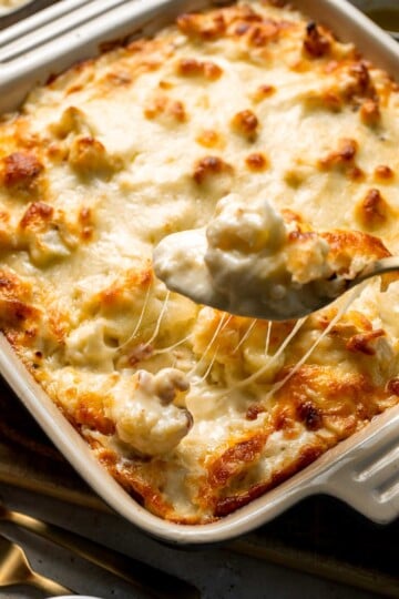 Easy Baked Cauliflower Cheese is the ultimate creamy, cheesy, golden comfort food side dish made with roasted cauliflower and rich homemade cheese sauce. | aheadofthyme.com