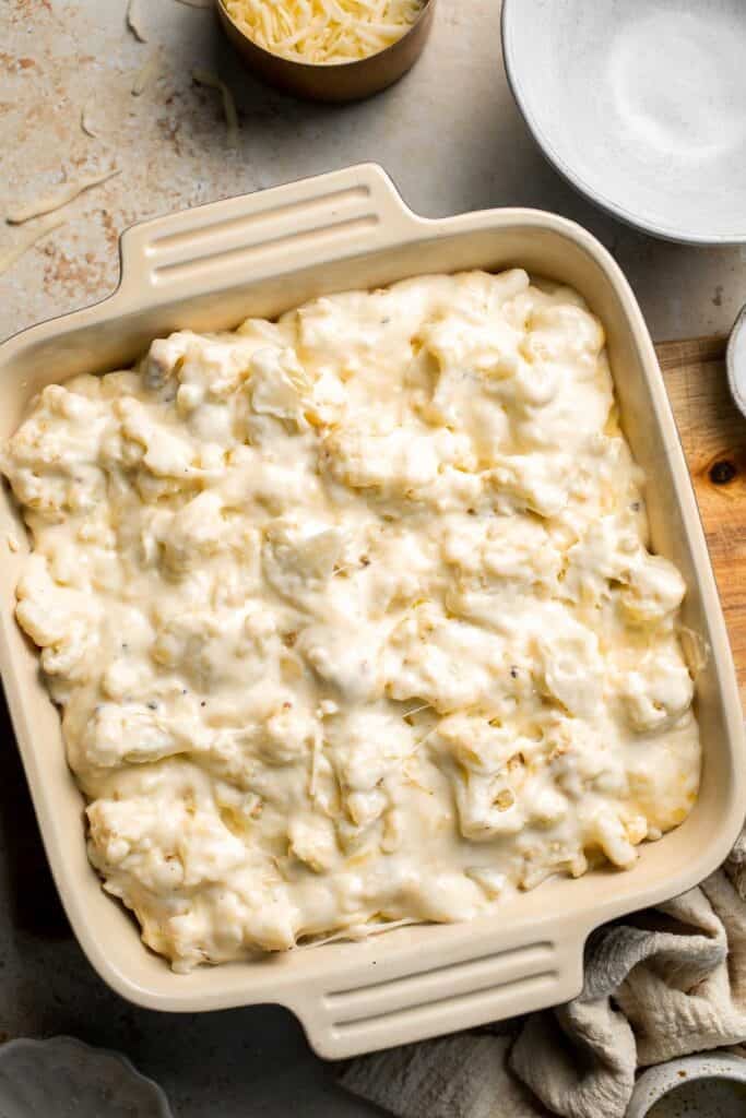 Easy Baked Cauliflower Cheese is the ultimate creamy, cheesy, golden comfort food side dish made with roasted cauliflower and rich homemade cheese sauce. | aheadofthyme.com