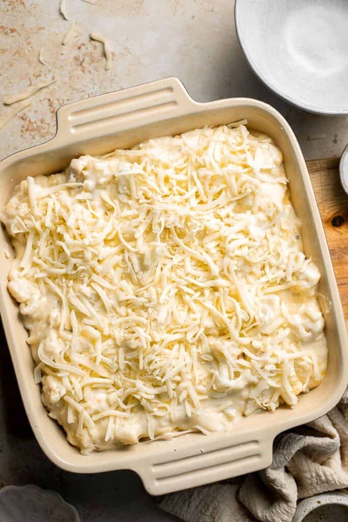 Easy Baked Cauliflower Cheese is the ultimate creamy, cheesy, golden comfort food side dish made with roasted cauliflower and rich homemade cheese sauce. | aheadofthyme.com
