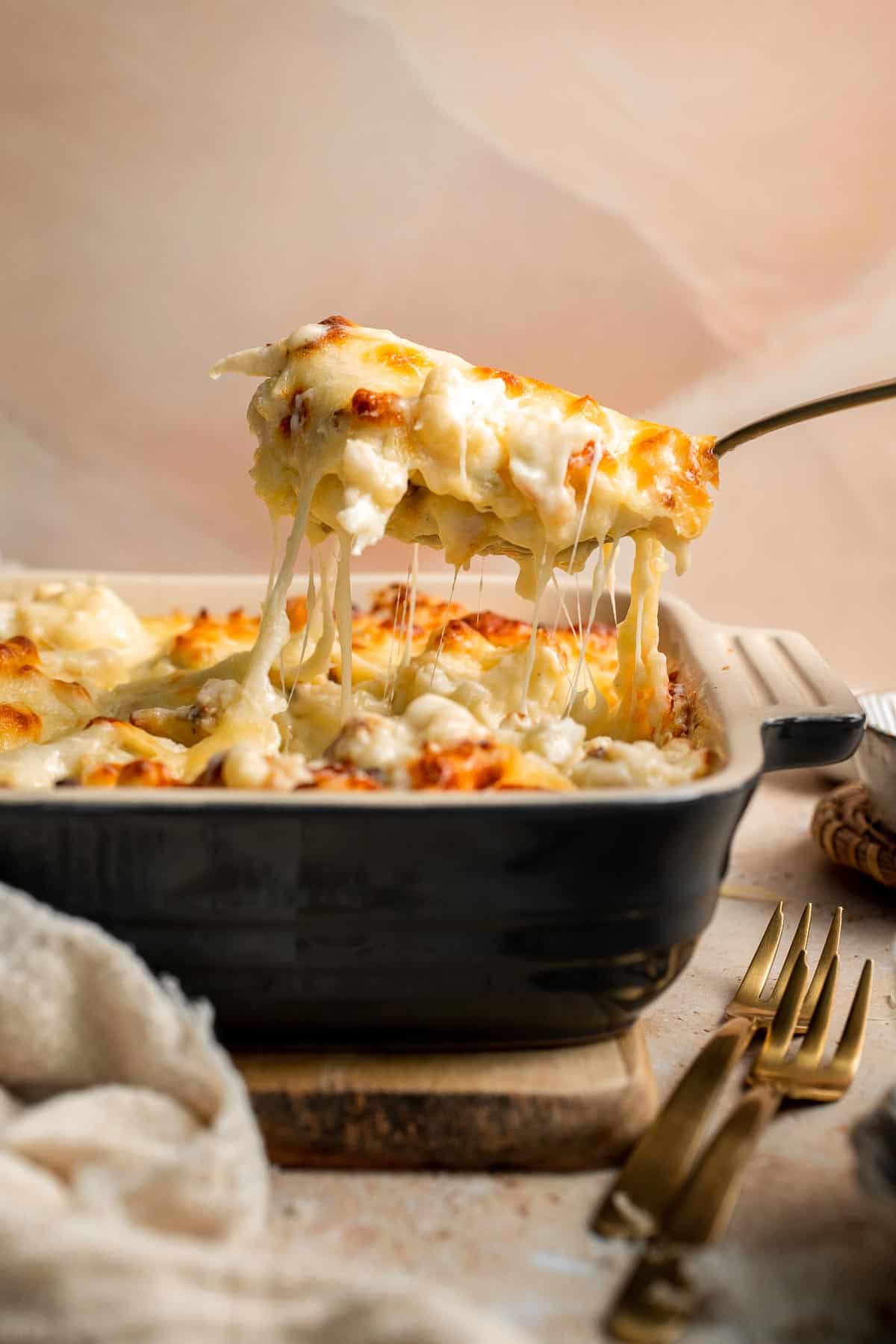 Easy Baked Cauliflower Cheese is the ultimate creamy, cheesy, golden comfort food side dish made with roasted cauliflower and rich homemade cheese sauce. | aheadofthyme.com