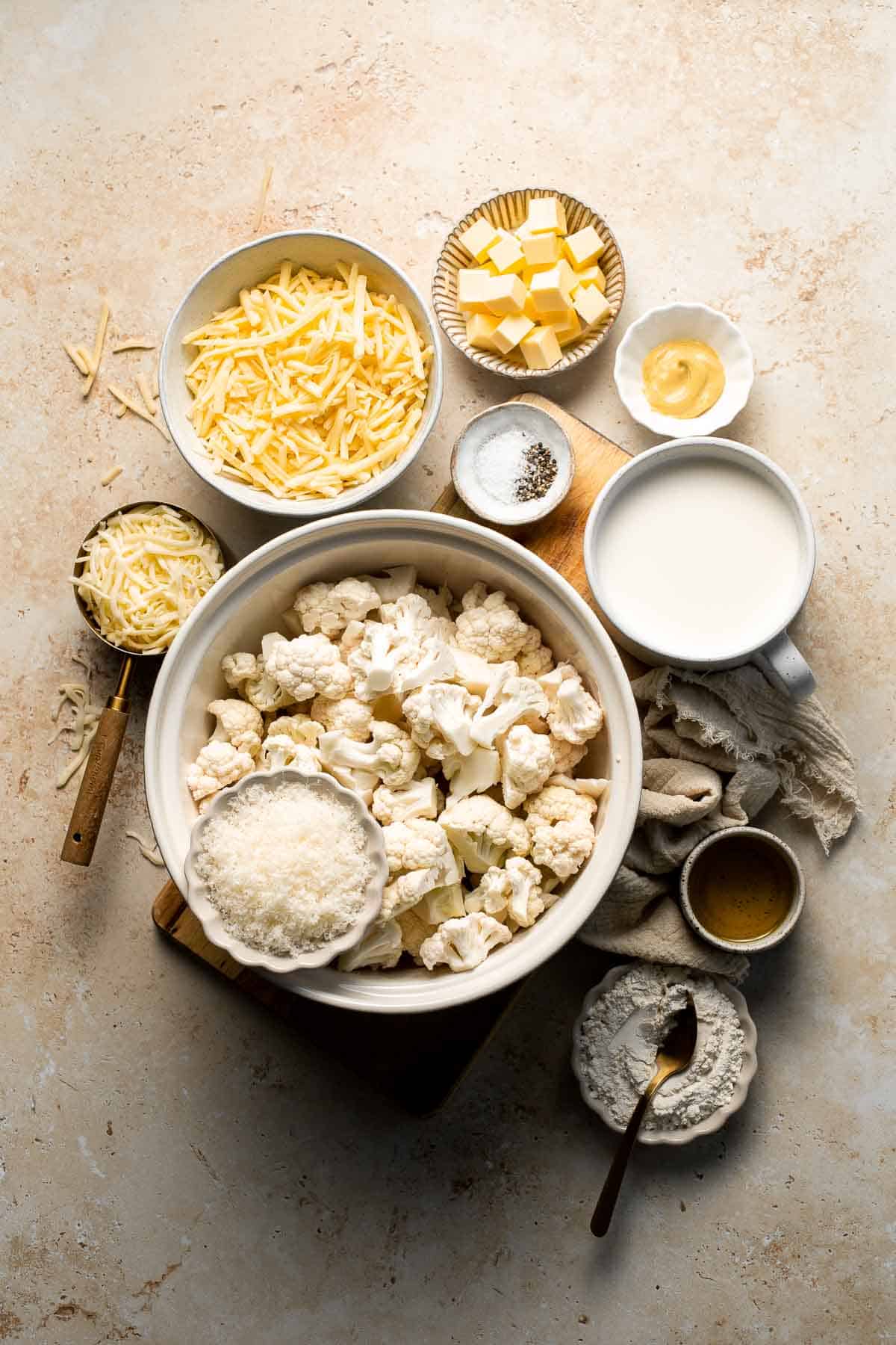 Easy Baked Cauliflower Cheese is the ultimate creamy, cheesy, golden comfort food side dish made with roasted cauliflower and rich homemade cheese sauce. | aheadofthyme.com