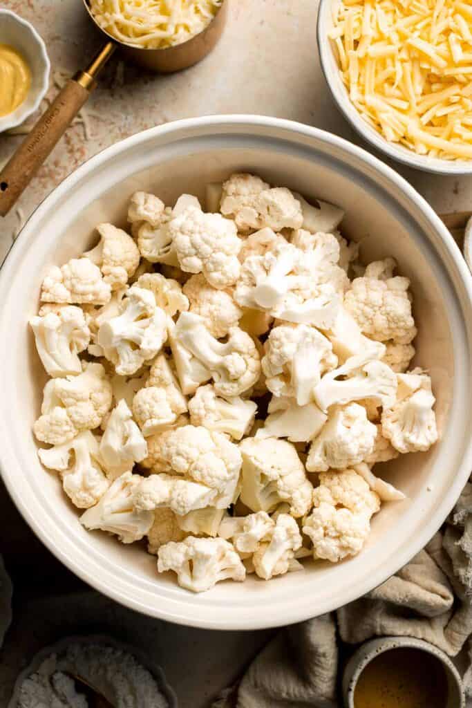 Easy Baked Cauliflower Cheese is the ultimate creamy, cheesy, golden comfort food side dish made with roasted cauliflower and rich homemade cheese sauce. | aheadofthyme.com