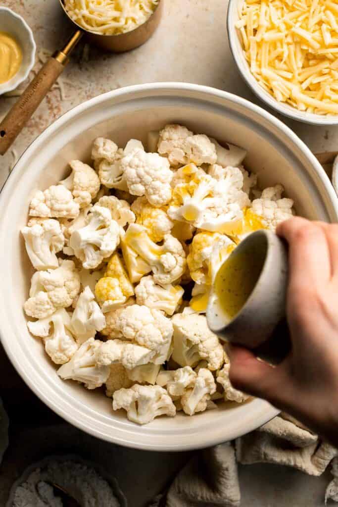 Easy Baked Cauliflower Cheese is the ultimate creamy, cheesy, golden comfort food side dish made with roasted cauliflower and rich homemade cheese sauce. | aheadofthyme.com