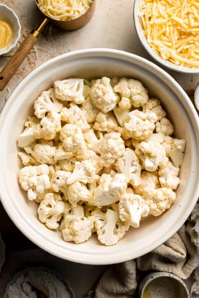 Easy Baked Cauliflower Cheese is the ultimate creamy, cheesy, golden comfort food side dish made with roasted cauliflower and rich homemade cheese sauce. | aheadofthyme.com