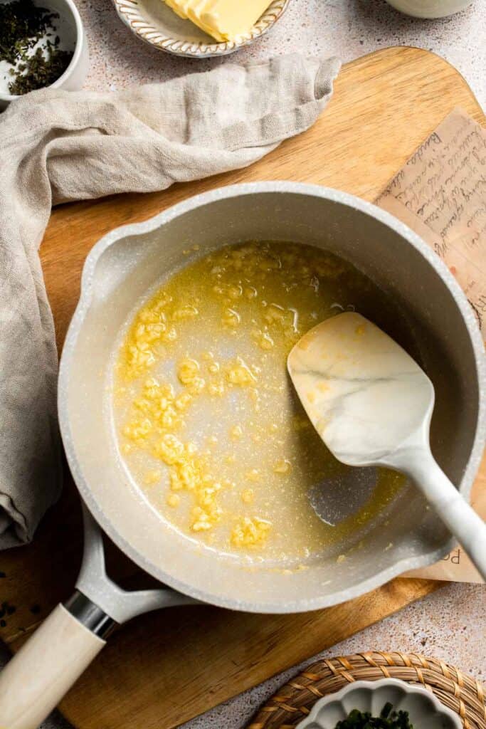 Creamy Garlic Herb Mashed Potatoes are buttery, flavorful, and easy to make. The perfect side dish for holidays or weeknight dinners. | aheadofthyme.com