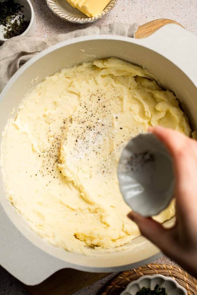 Creamy Garlic Herb Mashed Potatoes are buttery, flavorful, and easy to make. The perfect side dish for holidays or weeknight dinners. | aheadofthyme.com