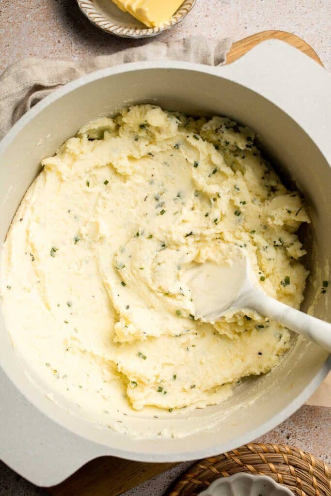 Creamy Garlic Herb Mashed Potatoes are buttery, flavorful, and easy to make. The perfect side dish for holidays or weeknight dinners. | aheadofthyme.com