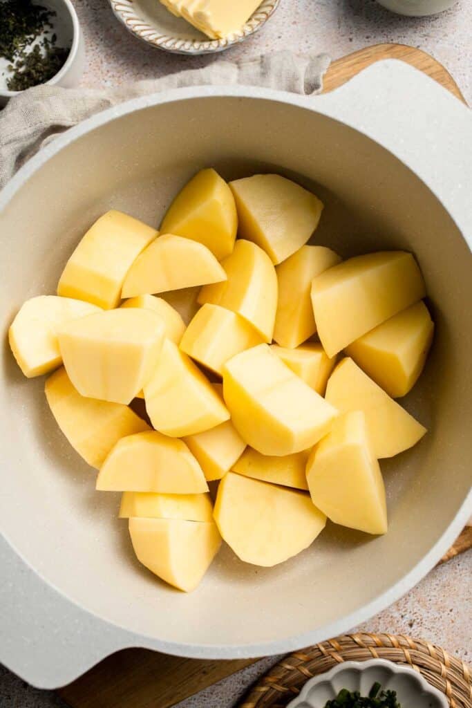 Creamy Garlic Herb Mashed Potatoes are buttery, flavorful, and easy to make. The perfect side dish for holidays or weeknight dinners. | aheadofthyme.com