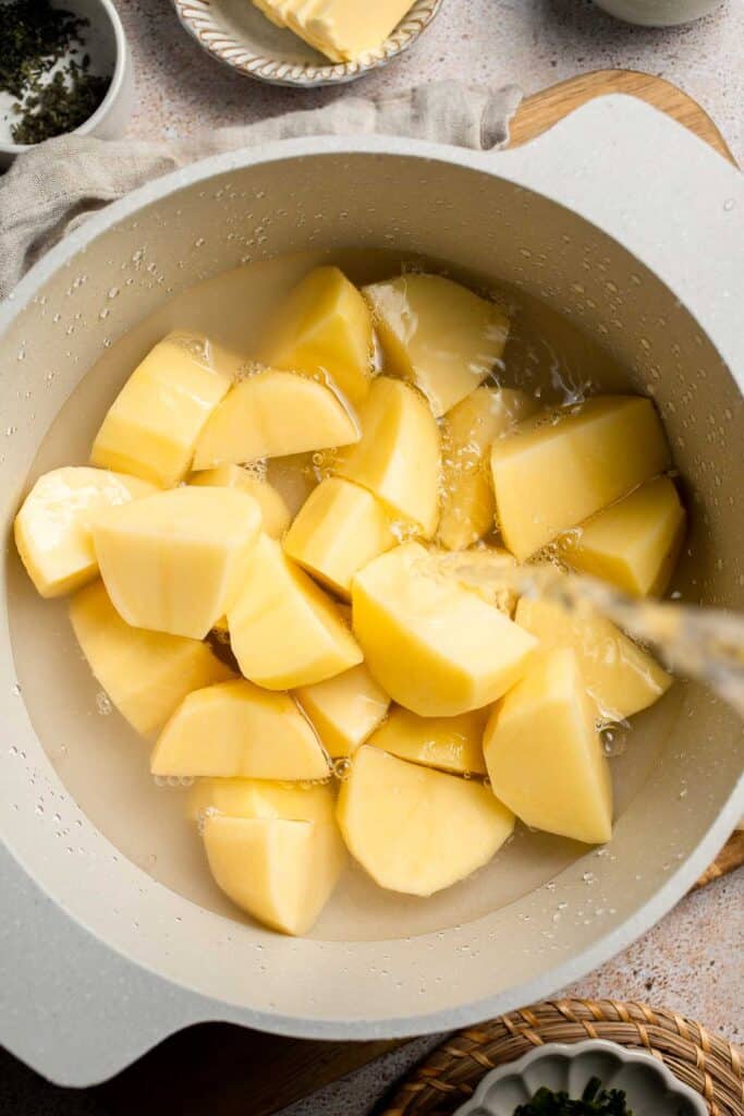 Creamy Garlic Herb Mashed Potatoes are buttery, flavorful, and easy to make. The perfect side dish for holidays or weeknight dinners. | aheadofthyme.com