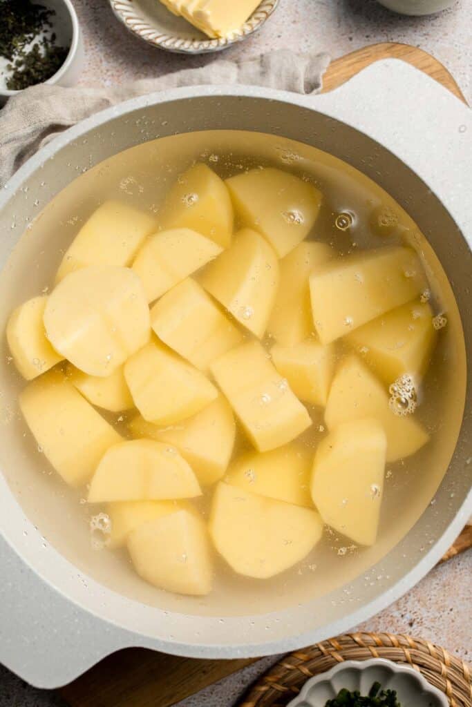 Creamy Garlic Herb Mashed Potatoes are buttery, flavorful, and easy to make. The perfect side dish for holidays or weeknight dinners. | aheadofthyme.com