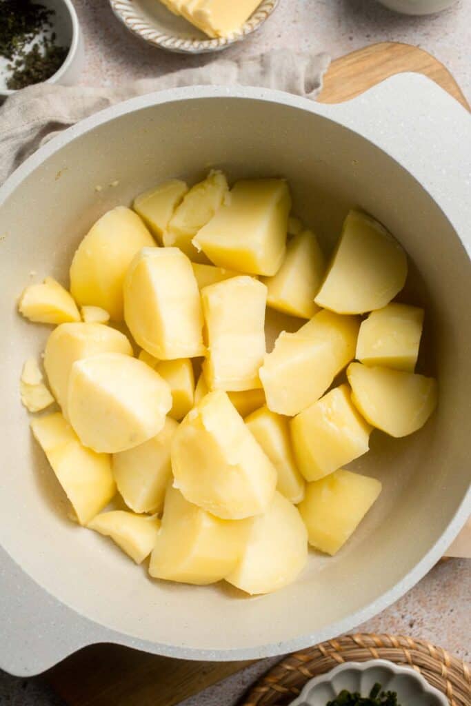 Creamy Garlic Herb Mashed Potatoes are buttery, flavorful, and easy to make. The perfect side dish for holidays or weeknight dinners. | aheadofthyme.com