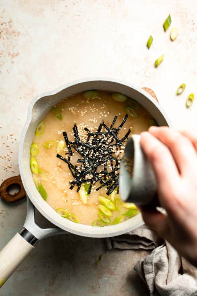 Learn how to make nourishing homemade miso soup with tofu. This traditional Japanese recipe is packed with umami flavor and easy to make in 10 minutes. | aheadofthyme.com