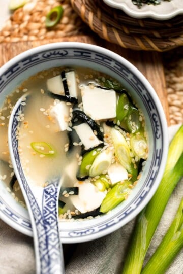 Learn how to make nourishing homemade miso soup with tofu. This traditional Japanese recipe is packed with umami flavor and easy to make in 10 minutes. | aheadofthyme.com