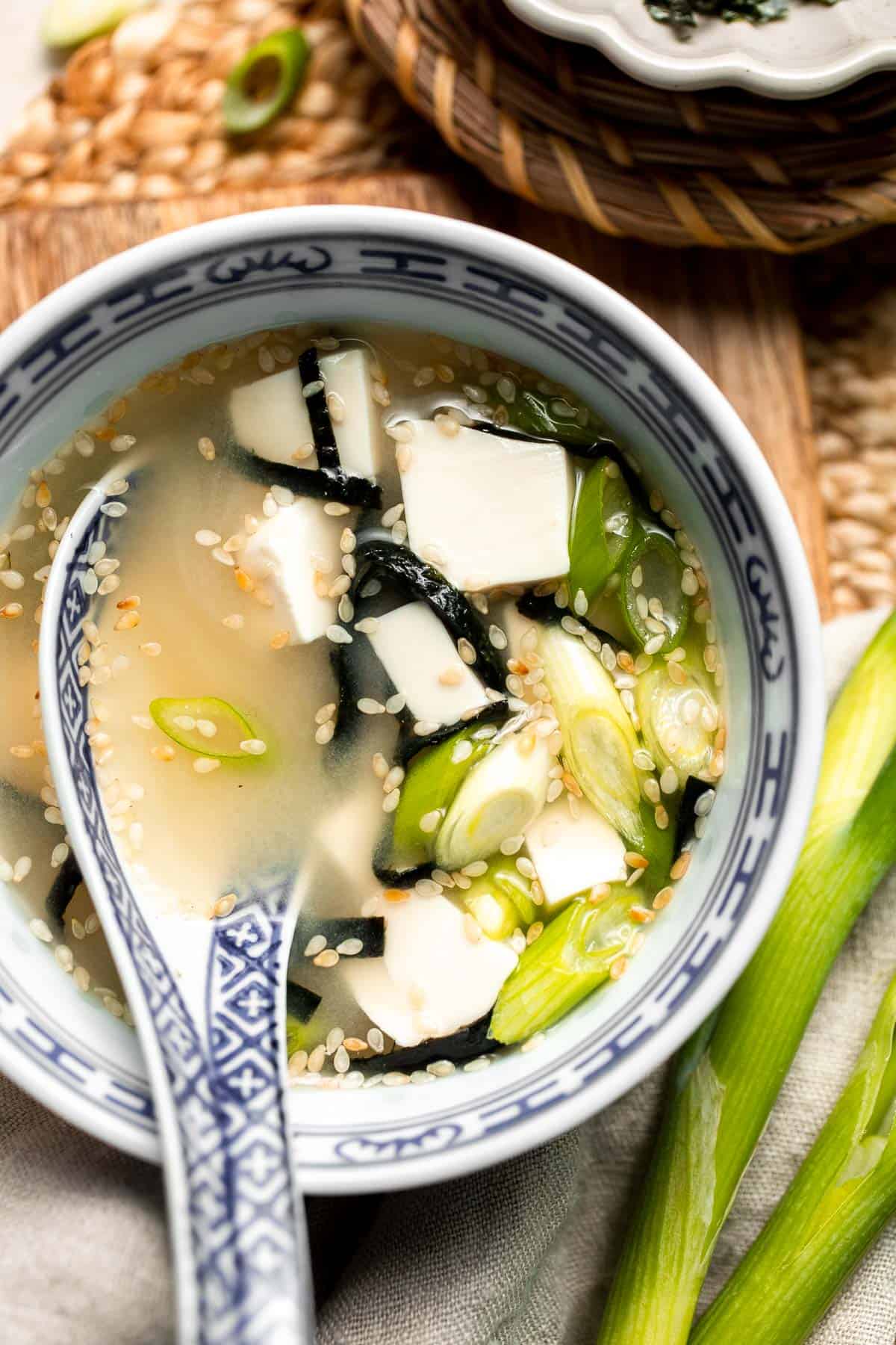 Learn how to make nourishing homemade miso soup with tofu. This traditional Japanese recipe is packed with umami flavor and easy to make in 10 minutes. | aheadofthyme.com