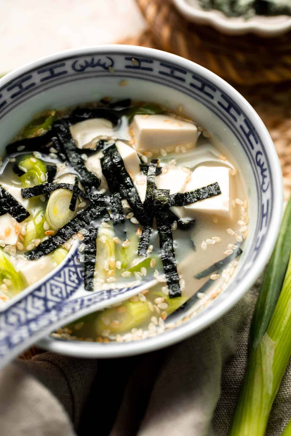 Learn how to make nourishing homemade miso soup with tofu. This traditional Japanese recipe is packed with umami flavor and easy to make in 10 minutes. | aheadofthyme.com