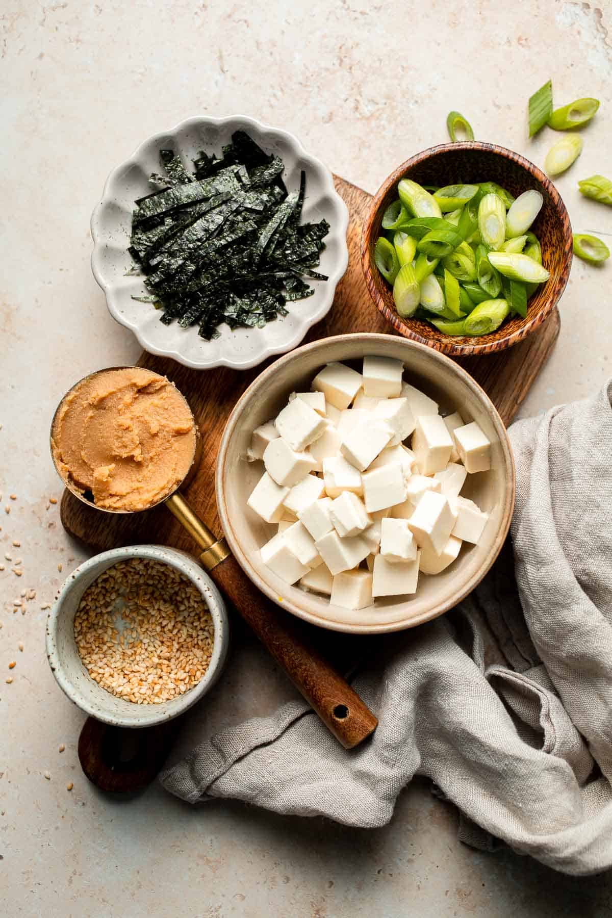Learn how to make nourishing homemade miso soup with tofu. This traditional Japanese recipe is packed with umami flavor and easy to make in 10 minutes. | aheadofthyme.com