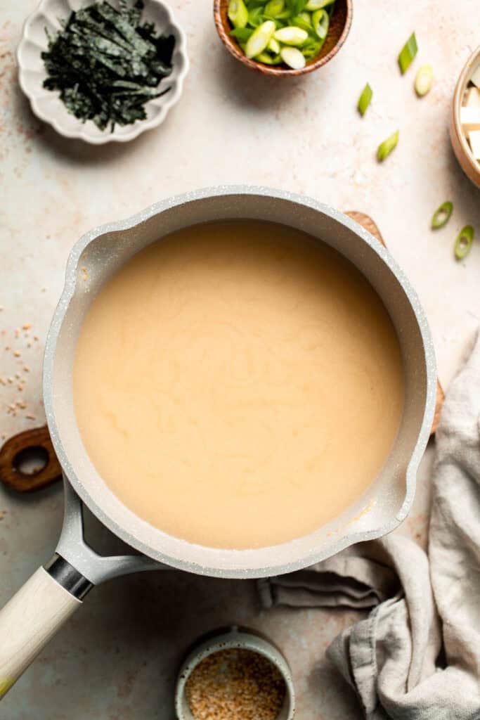 Learn how to make nourishing homemade miso soup with tofu. This traditional Japanese recipe is packed with umami flavor and easy to make in 10 minutes. | aheadofthyme.com