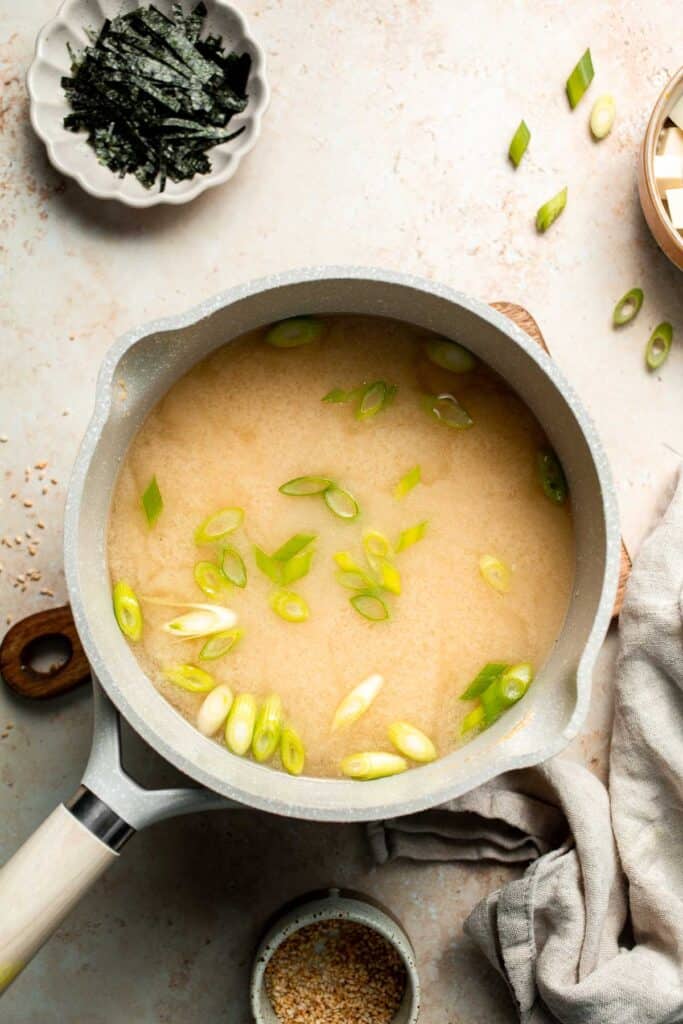 Learn how to make nourishing homemade miso soup with tofu. This traditional Japanese recipe is packed with umami flavor and easy to make in 10 minutes. | aheadofthyme.com