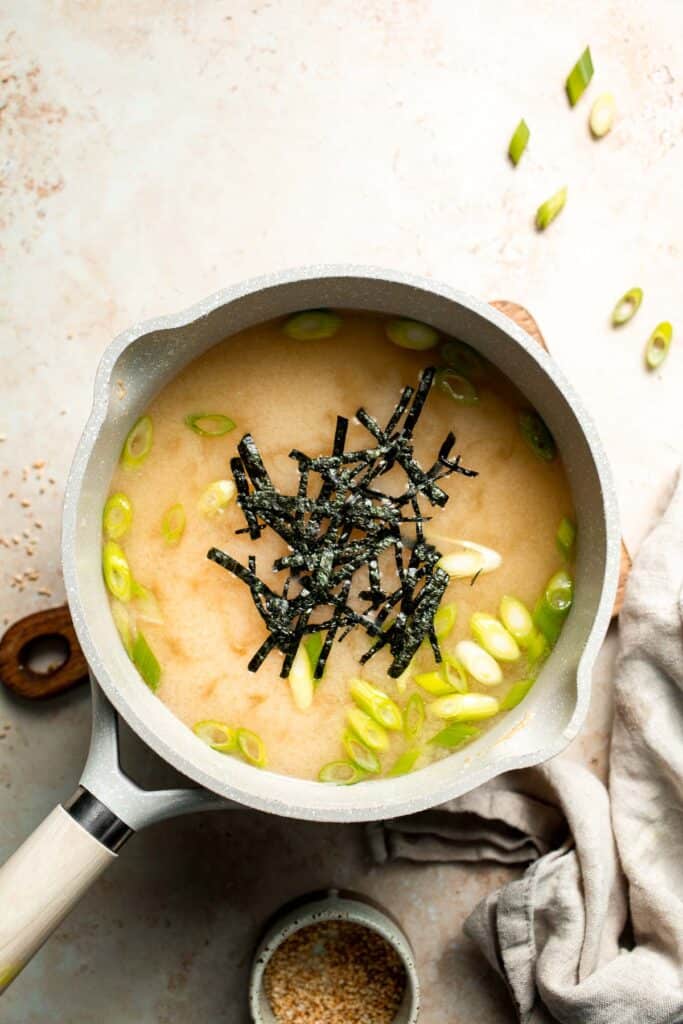 Learn how to make nourishing homemade miso soup with tofu. This traditional Japanese recipe is packed with umami flavor and easy to make in 10 minutes. | aheadofthyme.com