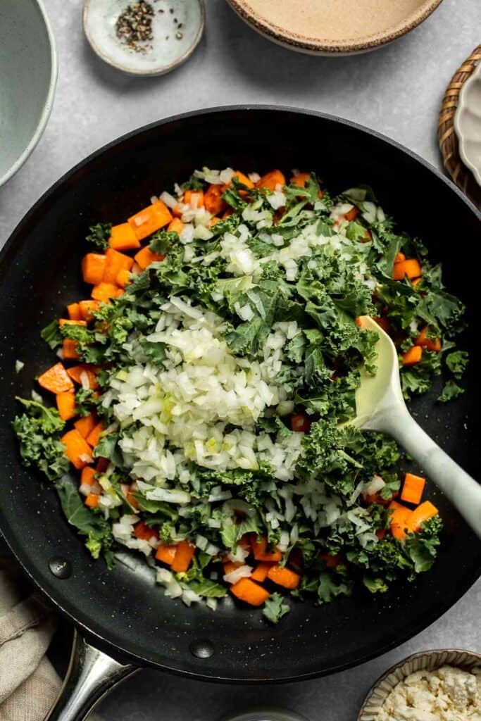 Kale and Sweet Potato Frittata is a protein-packed, one-pan meal with nutrient-dense kale, sweet potatoes, and creamy feta in a fluffy egg base. | aheadofthyme.com