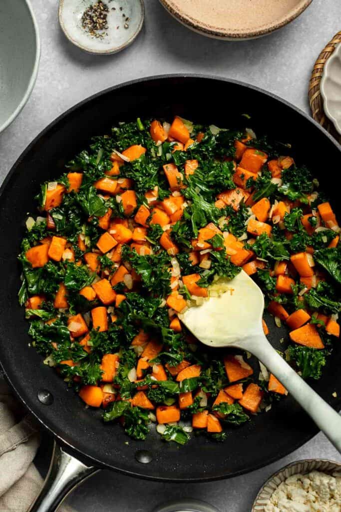 Kale and Sweet Potato Frittata is a protein-packed, one-pan meal with nutrient-dense kale, sweet potatoes, and creamy feta in a fluffy egg base. | aheadofthyme.com
