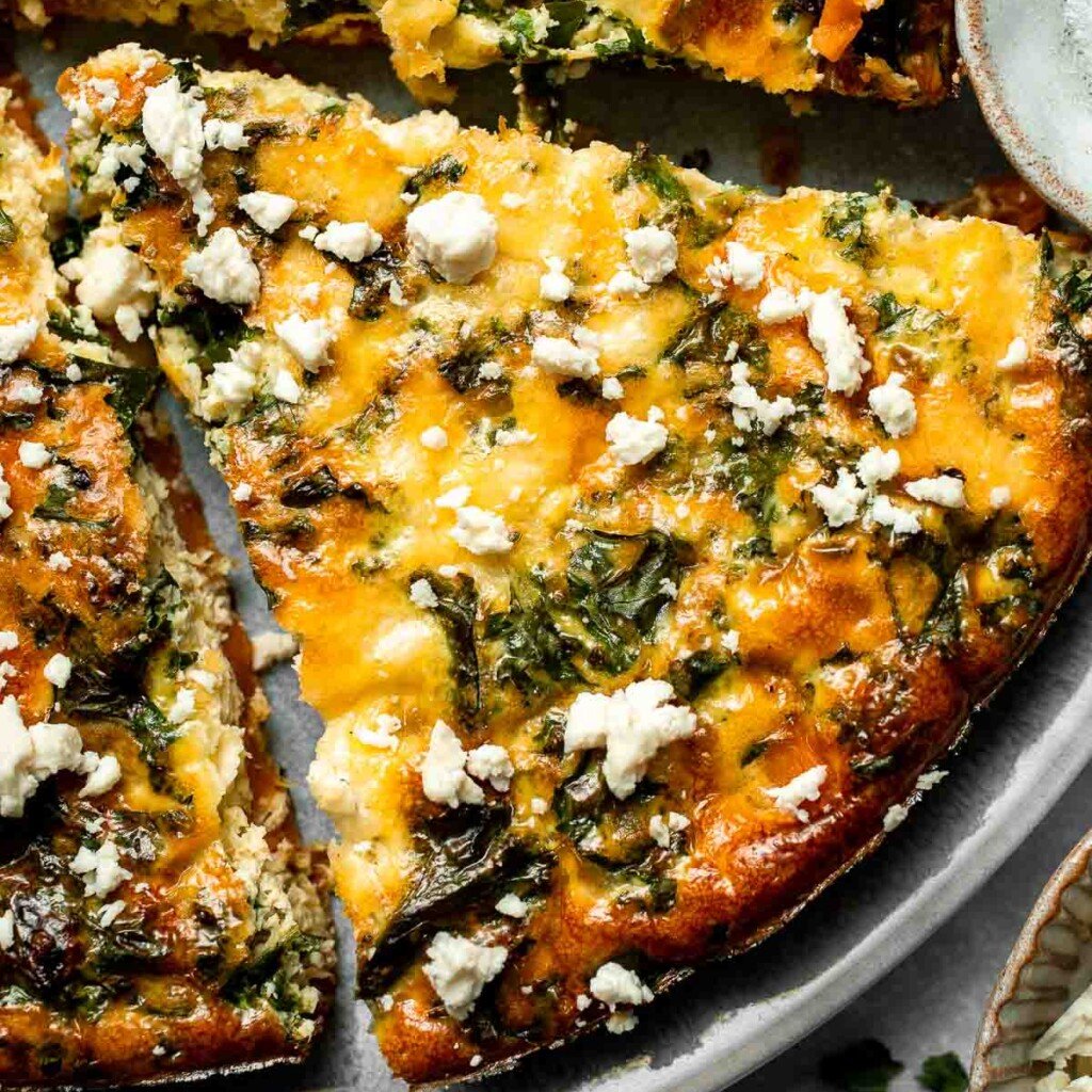 Kale and Sweet Potato Frittata is a protein-packed, one-pan meal with nutrient-dense kale, sweet potatoes, and creamy feta in a fluffy egg base. | aheadofthyme.com