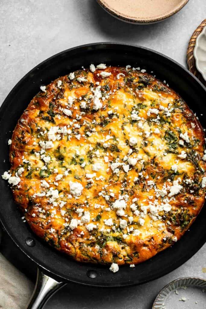 Kale and Sweet Potato Frittata is a protein-packed, one-pan meal with nutrient-dense kale, sweet potatoes, and creamy feta in a fluffy egg base. | aheadofthyme.com