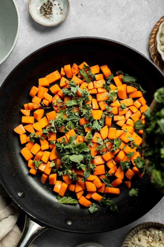 Kale and Sweet Potato Frittata is a protein-packed, one-pan meal with nutrient-dense kale, sweet potatoes, and creamy feta in a fluffy egg base. | aheadofthyme.com
