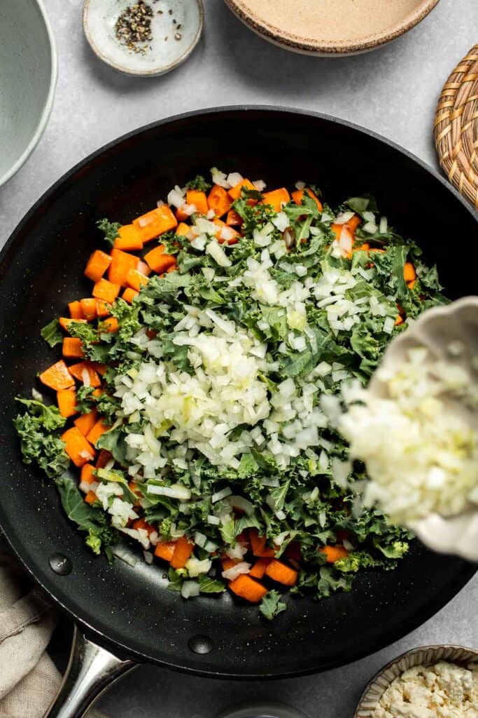 Kale and Sweet Potato Frittata is a protein-packed, one-pan meal with nutrient-dense kale, sweet potatoes, and creamy feta in a fluffy egg base. | aheadofthyme.com